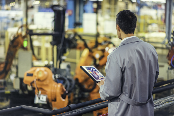 Engineer supervising autonomous producton process