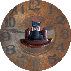 a clock face floor mural and a hacker sitting in the center on a laptop