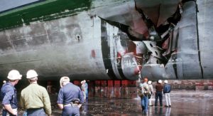 The USS Tripoli in dry dock in Bahrain for repairs after damaged by an Iraqi mine. February 1991.